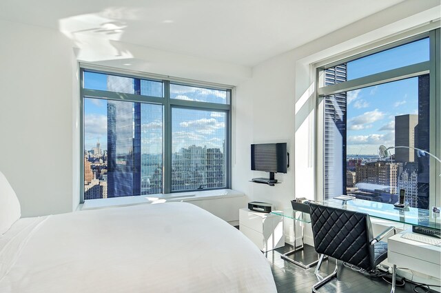 bedroom with hardwood / wood-style floors