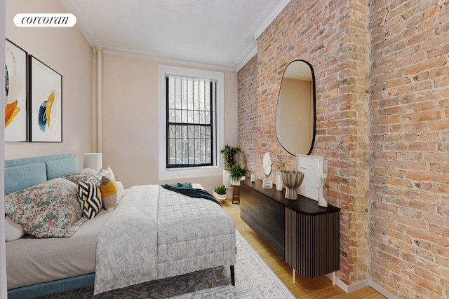 bedroom with ornamental molding, brick wall, and light wood-type flooring