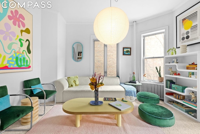 sitting room featuring radiator and ornamental molding