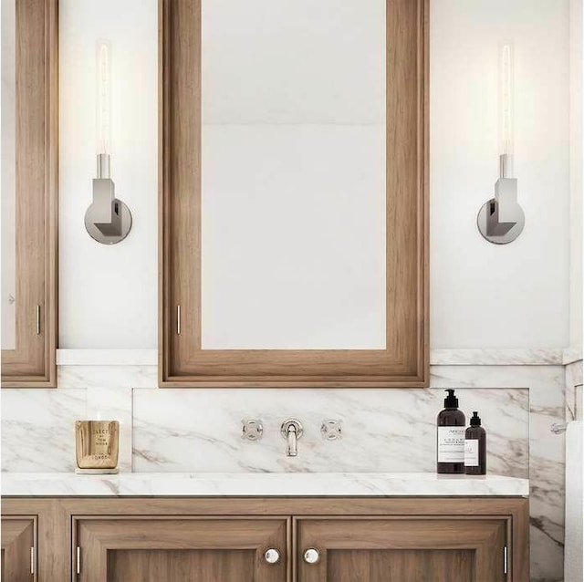 details featuring vanity and backsplash