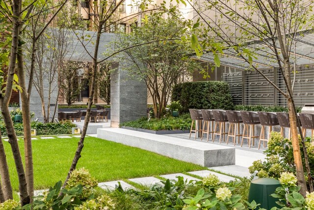 view of patio with an outdoor fireplace