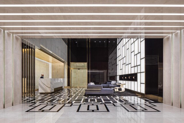 interior space featuring wood-type flooring, coffered ceiling, and beam ceiling