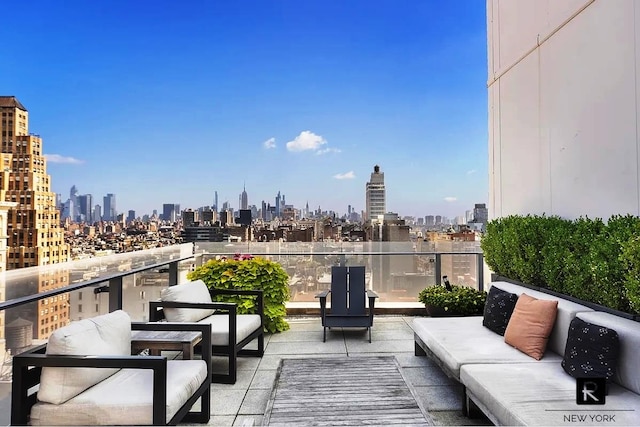 balcony with a city view and outdoor lounge area