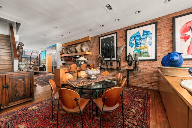 178 E 75th St, New York City, NY 10021 - dining area featuring hardwood / wood-style flooring, stairs, brick wall, and recessed lighting