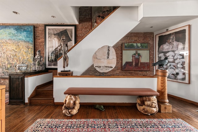 178 E 75th St, New York City, NY 10021 - detailed view of wood finished floors, baseboards, and brick wall