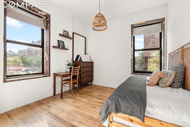 bedroom with wood-type flooring