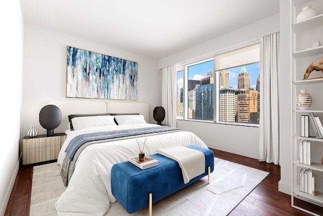 bedroom with hardwood / wood-style floors