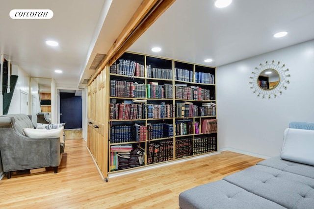 living area featuring visible vents, wood finished floors, and recessed lighting