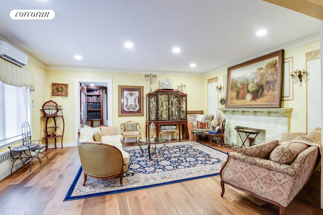 living area featuring wood finished floors, visible vents, crown molding, and a wall mounted AC