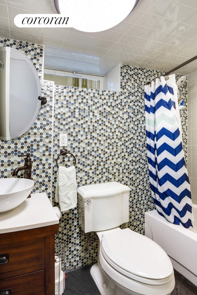 bathroom featuring shower / tub combo, decorative backsplash, toilet, vanity, and tile walls