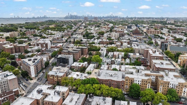 birds eye view of property featuring a city view