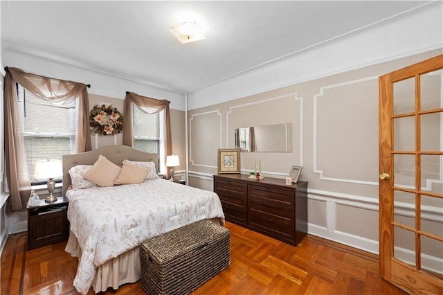 bedroom featuring a decorative wall