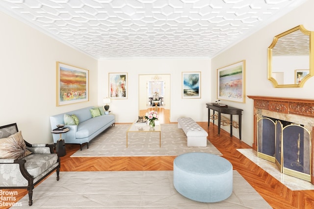living room with ornamental molding, a high end fireplace, and baseboards