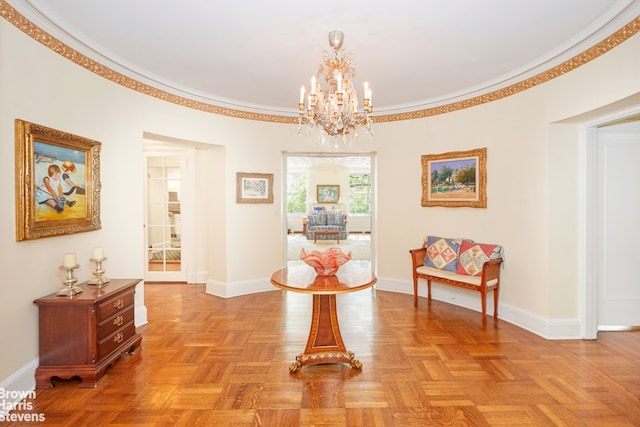 corridor with a notable chandelier, ornamental molding, and baseboards