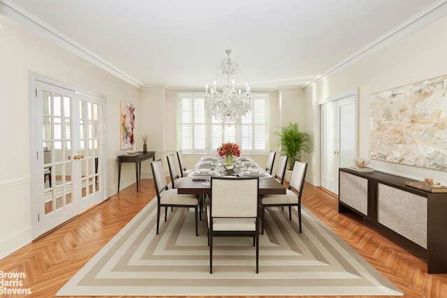dining space with a chandelier, ornamental molding, and baseboards