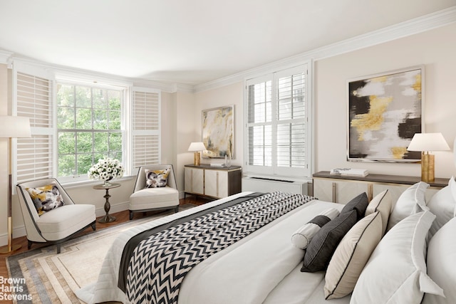 bedroom with multiple windows, ornamental molding, wood finished floors, and baseboards