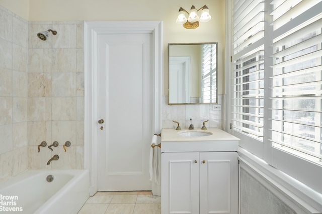 full bath with  shower combination, vanity, and tile patterned floors