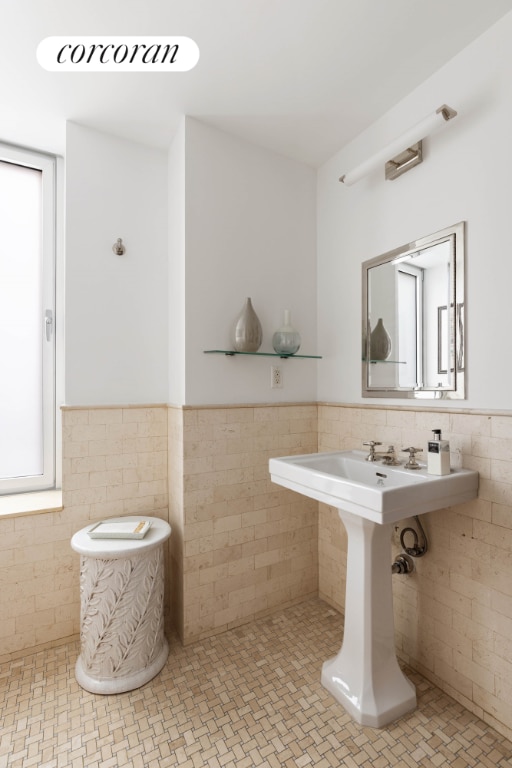 bathroom featuring tile walls and tile patterned flooring