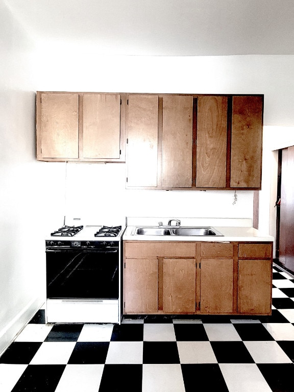 kitchen featuring sink and range with gas cooktop