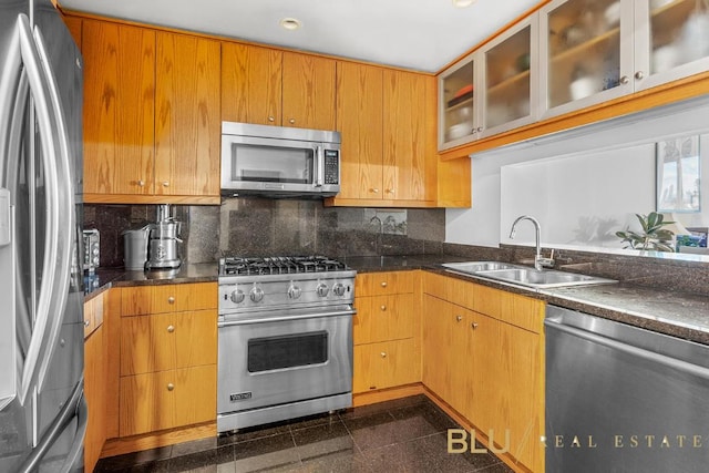 kitchen with stainless steel appliances, backsplash, and sink