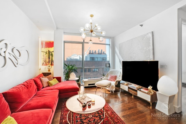 living room featuring dark hardwood / wood-style flooring and a notable chandelier