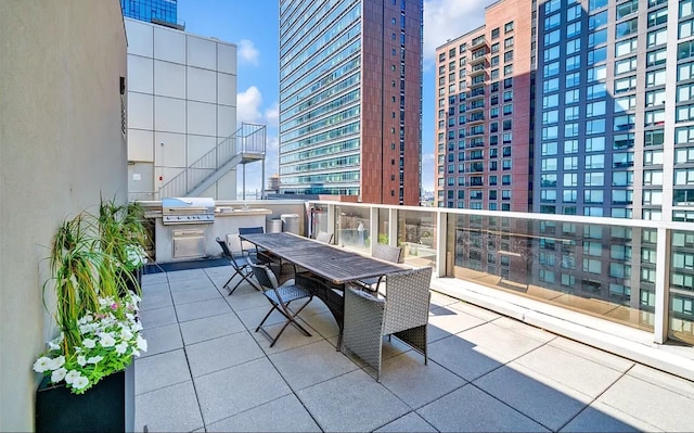 balcony with a grill and a patio area