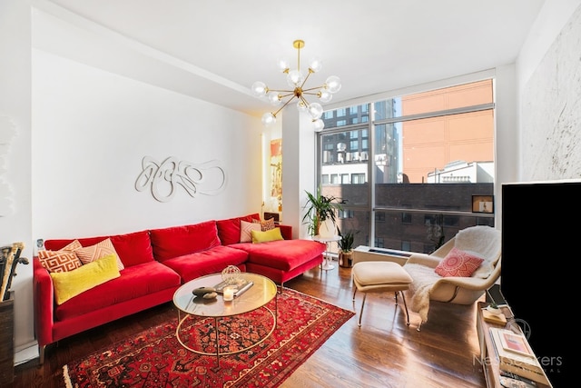 living room featuring hardwood / wood-style flooring, expansive windows, and an inviting chandelier