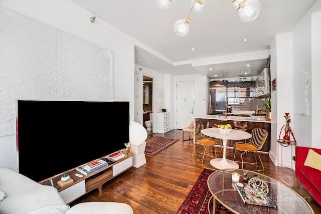 living room featuring dark wood-type flooring and bar