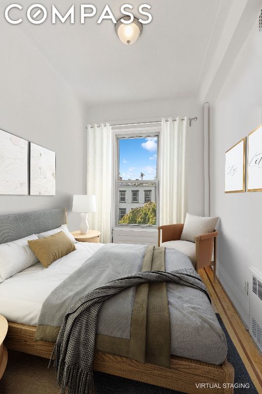 bedroom featuring radiator