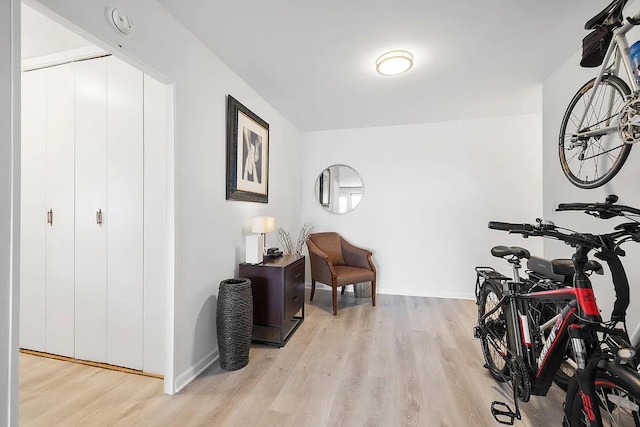 sitting room featuring light wood-style floors and baseboards