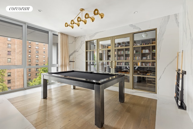 playroom with pool table, visible vents, and floor to ceiling windows