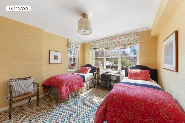 116 E 66th St Unit 8/9F, New York City, NY 10065 - bedroom with ornamental molding and carpet flooring