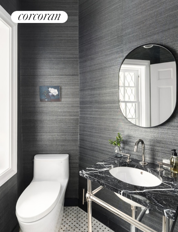 bathroom with sink, tile patterned floors, and toilet