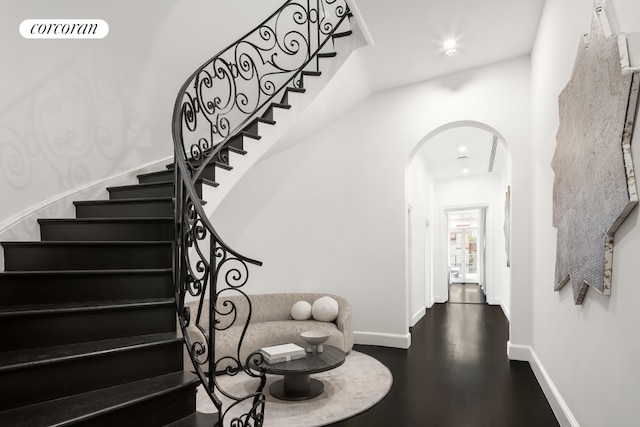 stairs featuring wood-type flooring