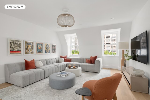 carpeted living room with crown molding and expansive windows