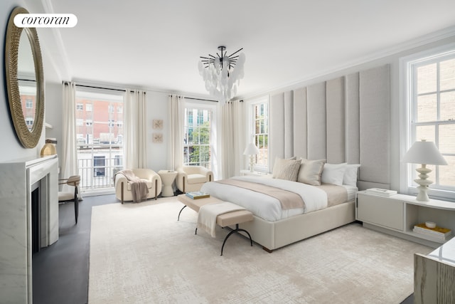 bedroom featuring ornamental molding and a notable chandelier