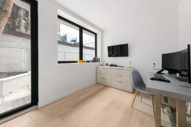 130 E 61st St, New York City, NY 10065 - bathroom featuring toilet, tile walls, vanity, and walk in shower