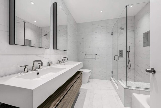 kitchen featuring stainless steel appliances, sink, hanging light fixtures, and white cabinets