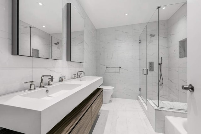 130 E 61st St, New York City, NY 10065 - kitchen featuring stainless steel appliances, sink, hanging light fixtures, and white cabinets