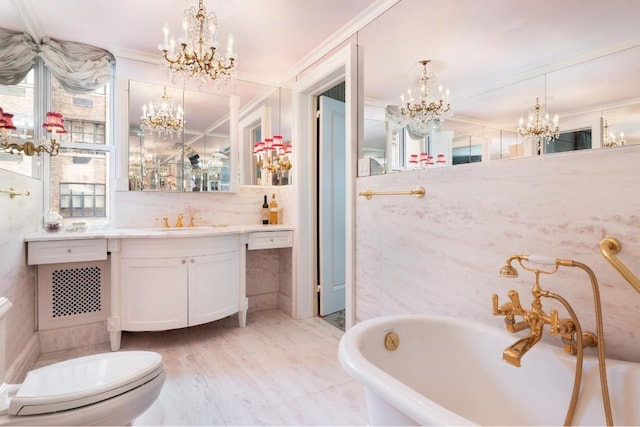 bathroom featuring toilet, a bathing tub, crown molding, and vanity