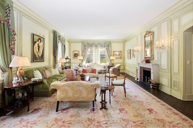 living room with hardwood / wood-style flooring and ornamental molding