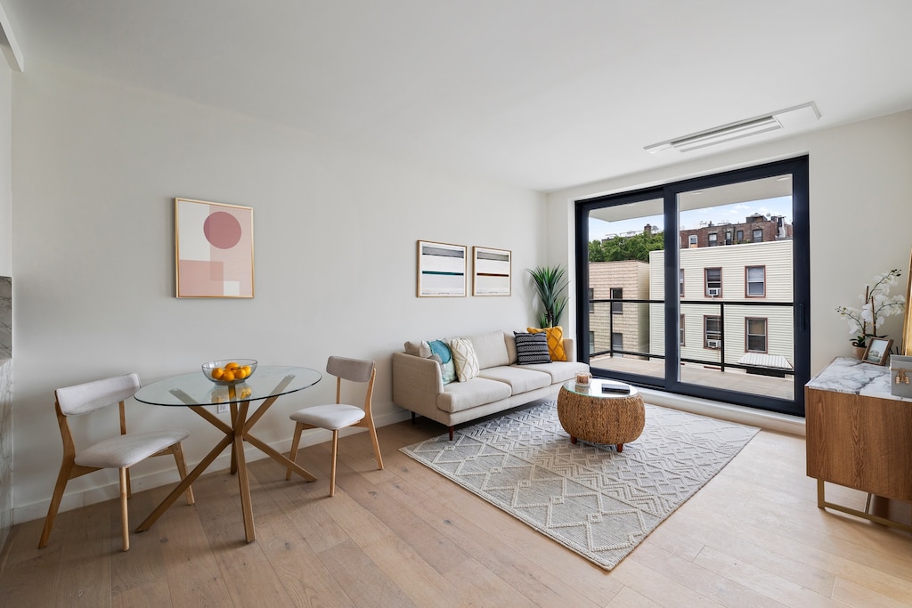 232 Eckford St Unit 3-R, New York City, NY 11222 - living room featuring light wood finished floors and baseboards
