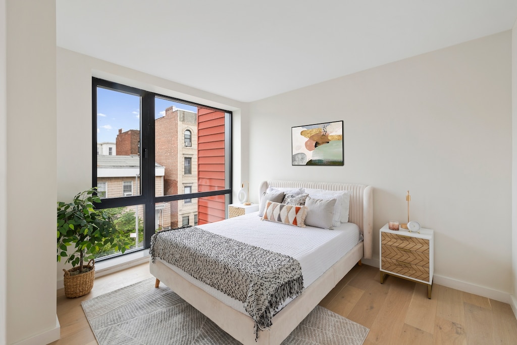 232 Eckford St Unit 3-R, New York City, NY 11222 - bedroom with light wood-type flooring and baseboards