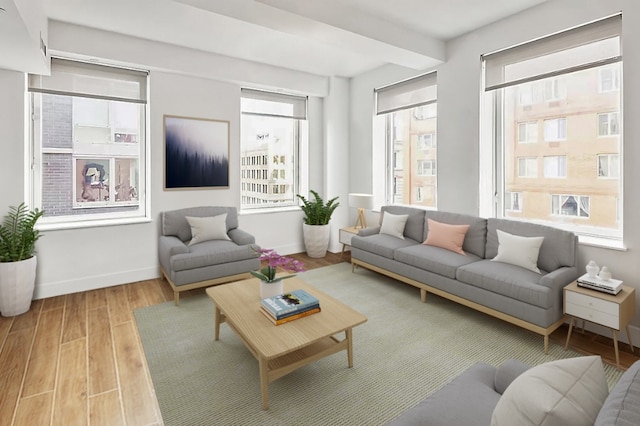 living room with a wealth of natural light and light hardwood / wood-style floors