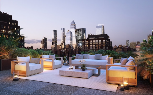 patio terrace at dusk featuring an outdoor hangout area