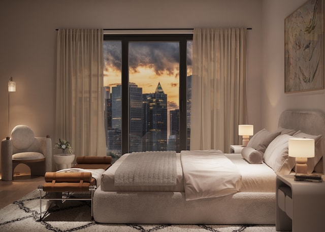 bedroom featuring a view of city, access to outside, and wood finished floors