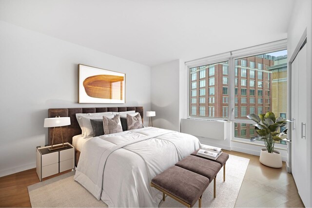 bedroom with light hardwood / wood-style flooring