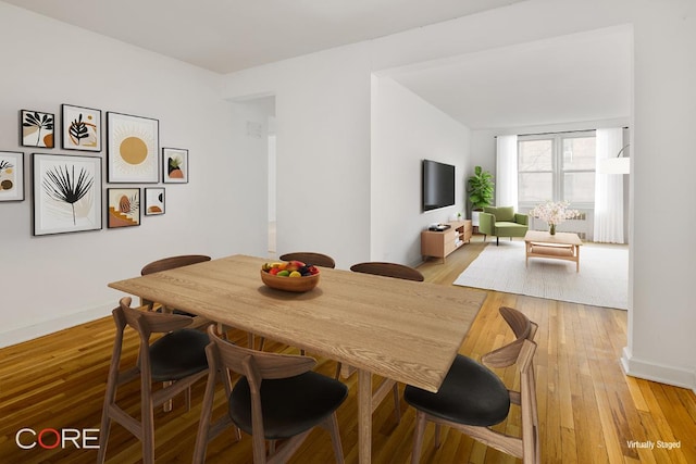 dining area with light hardwood / wood-style floors