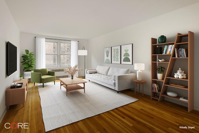 living room with hardwood / wood-style floors and radiator