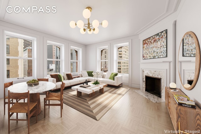 living area featuring a high end fireplace, a notable chandelier, and ornamental molding